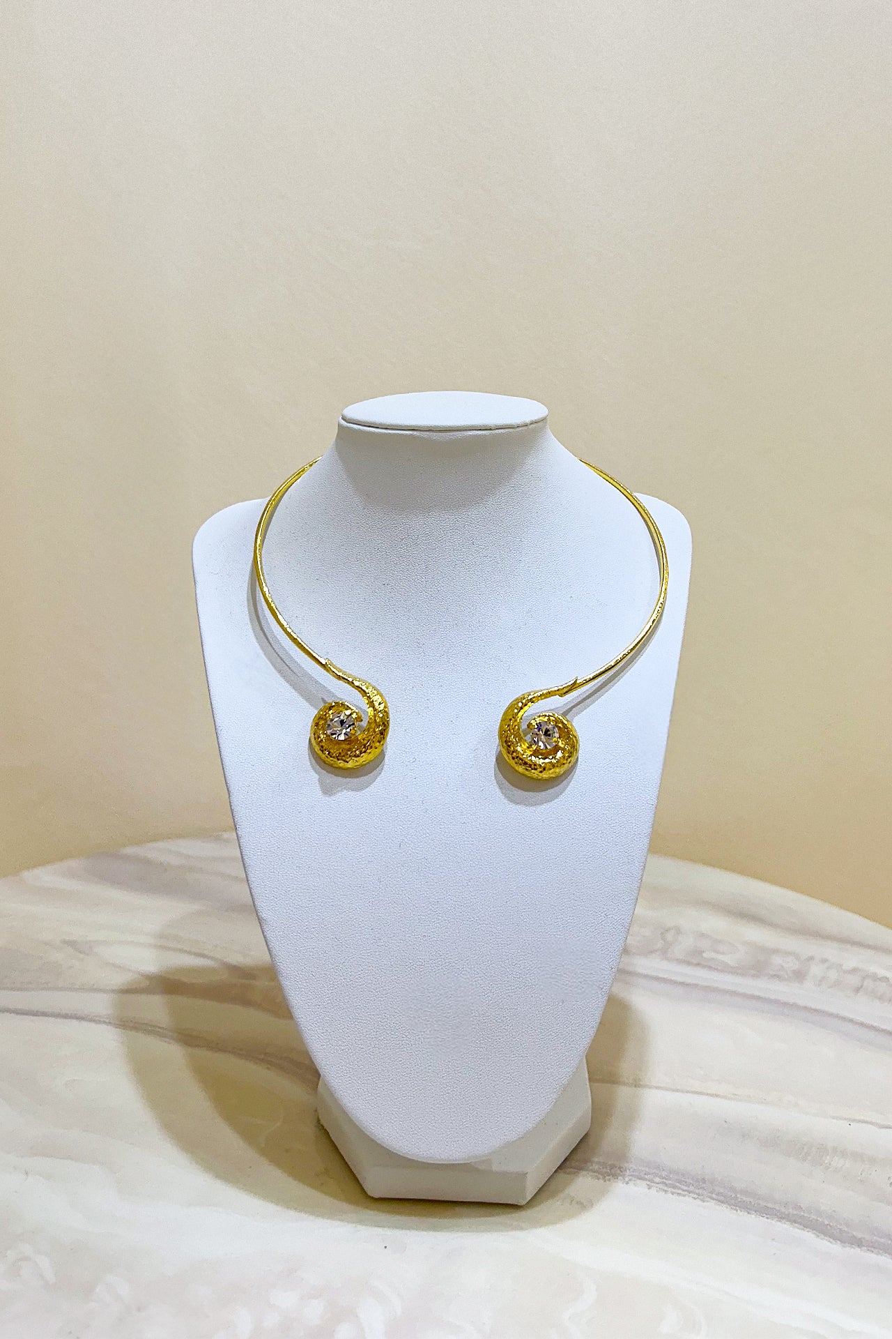 Gold Curved Twirl Necklace by M Collection