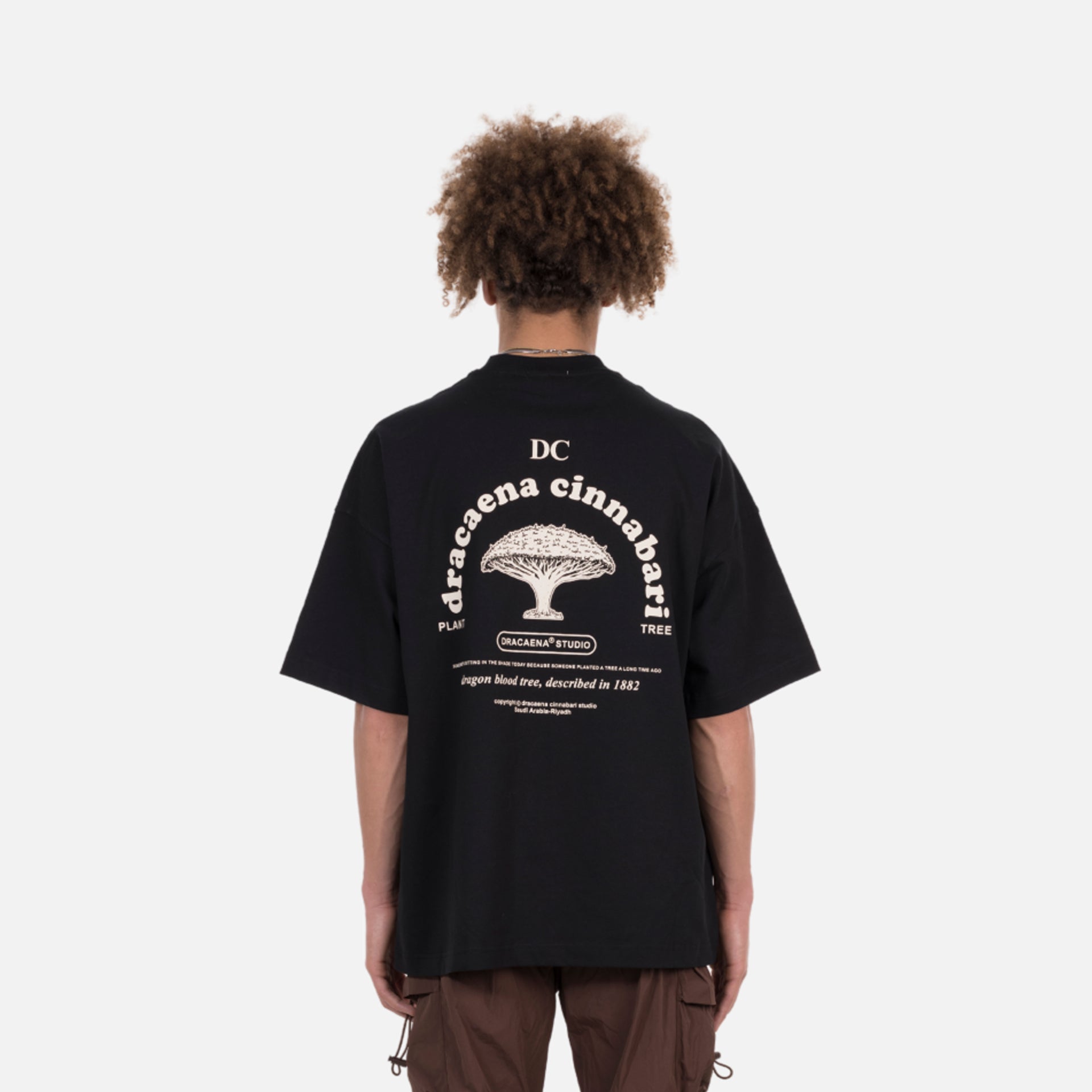 Black Oversized Cotton T-Shirt With Prints By Dracaena Cinnabari
