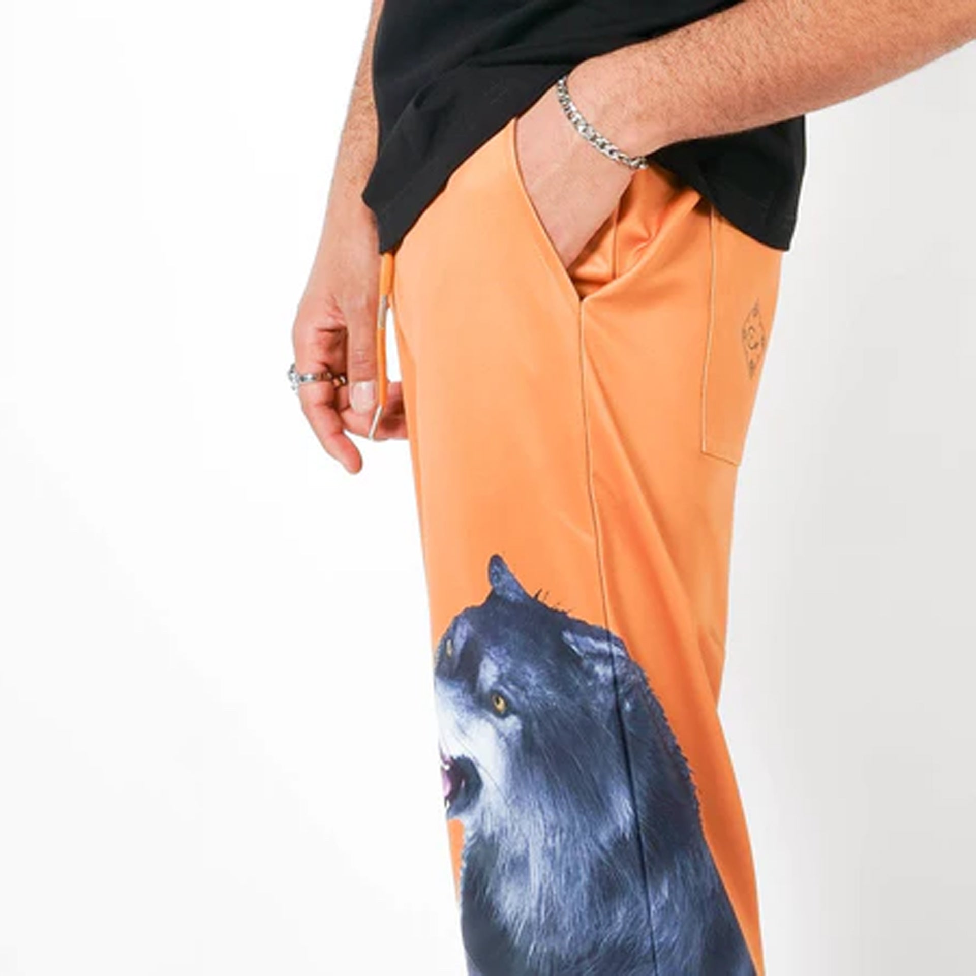 Orange pants with wolf print FROM HOUSE OF CENMAR