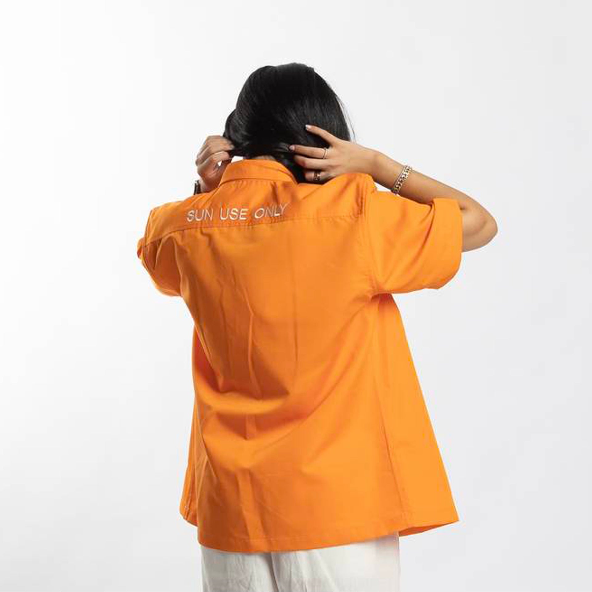 Orange Short-Sleeve Shirt With 'Sun Use Only' Typography on the Back From Hajruss