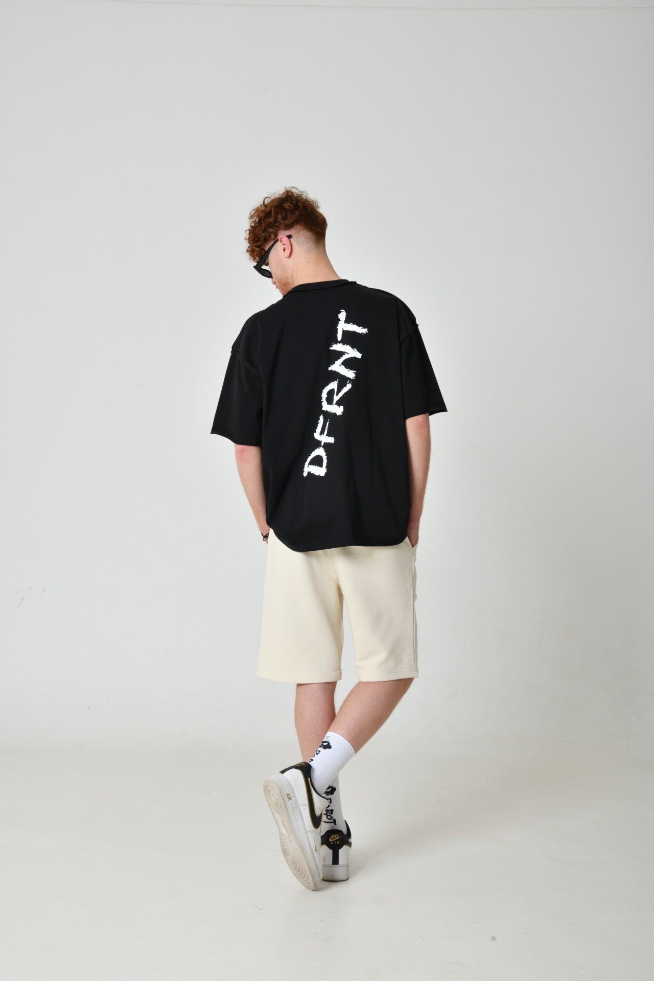 Black T-Shirt With A Print On The Back From DFRNT
