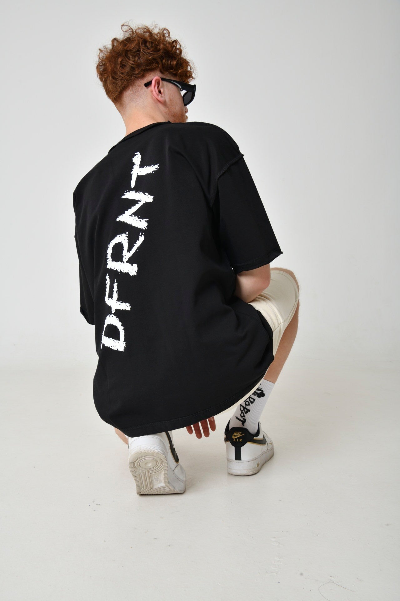 Black T-Shirt With A Print On The Back From DFRNT