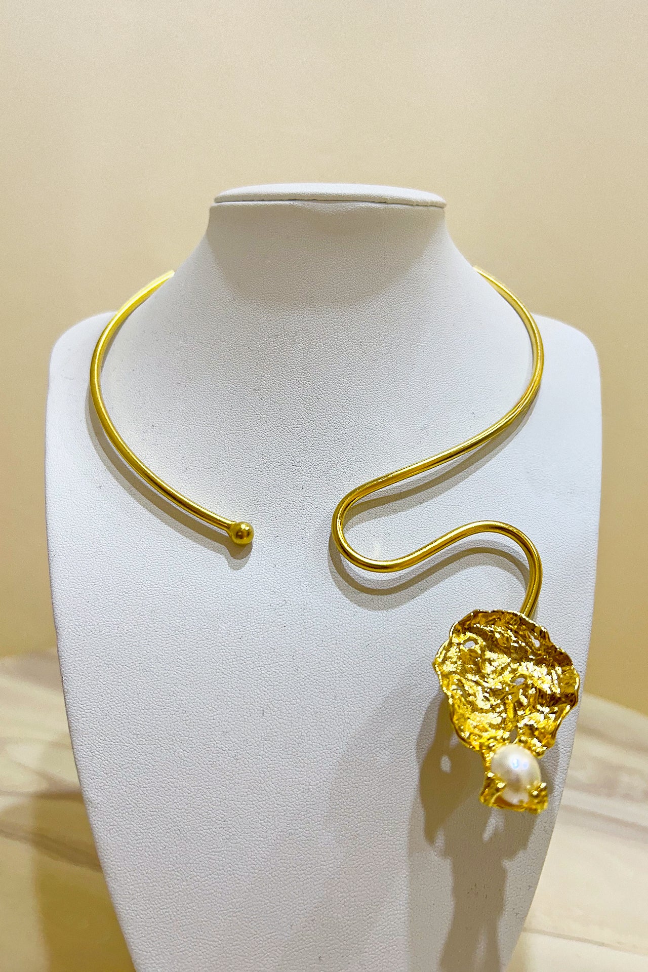 Gold Curved Leaf Necklace by M Collection