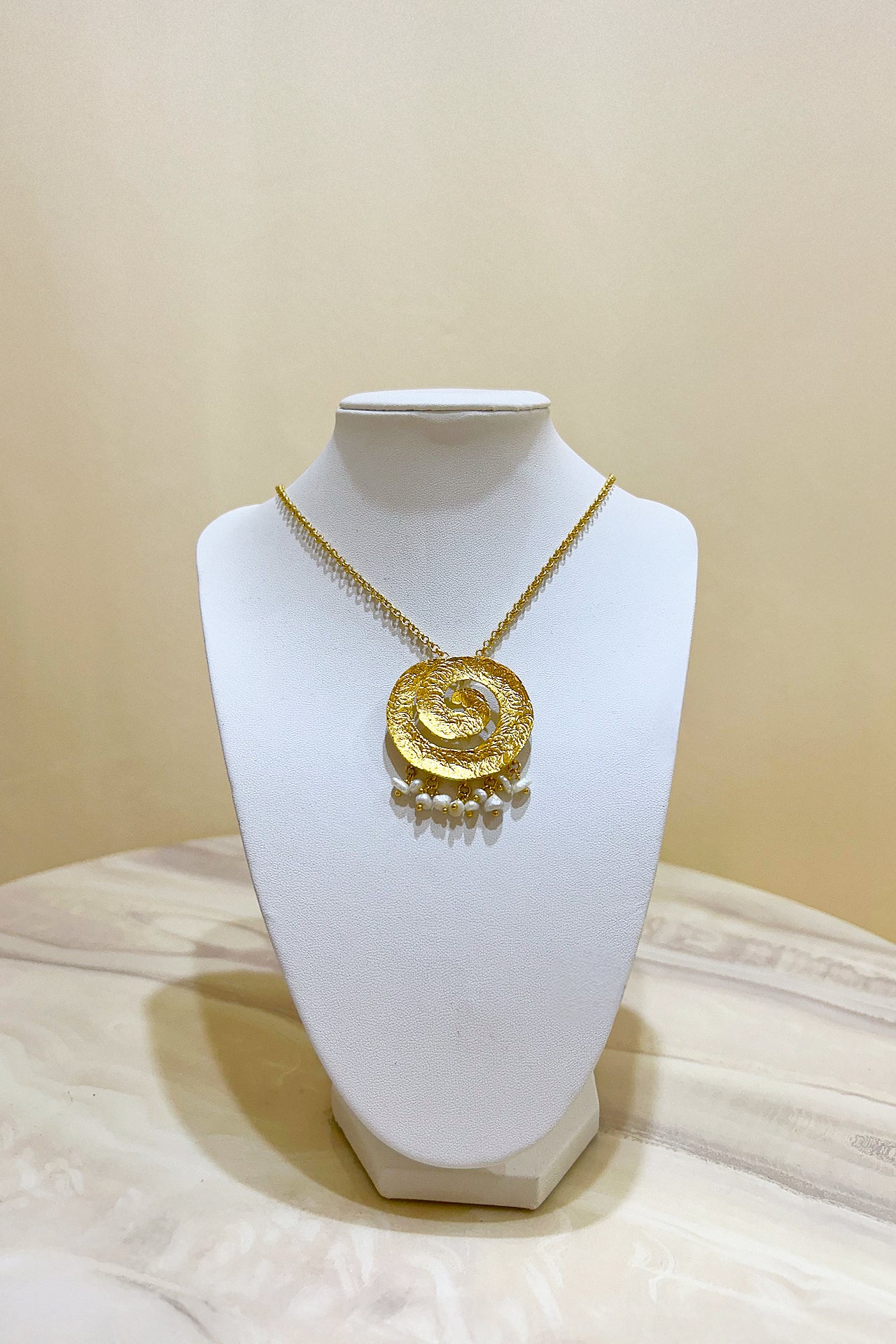 Gold Swirling Pearl Necklace by M Collection