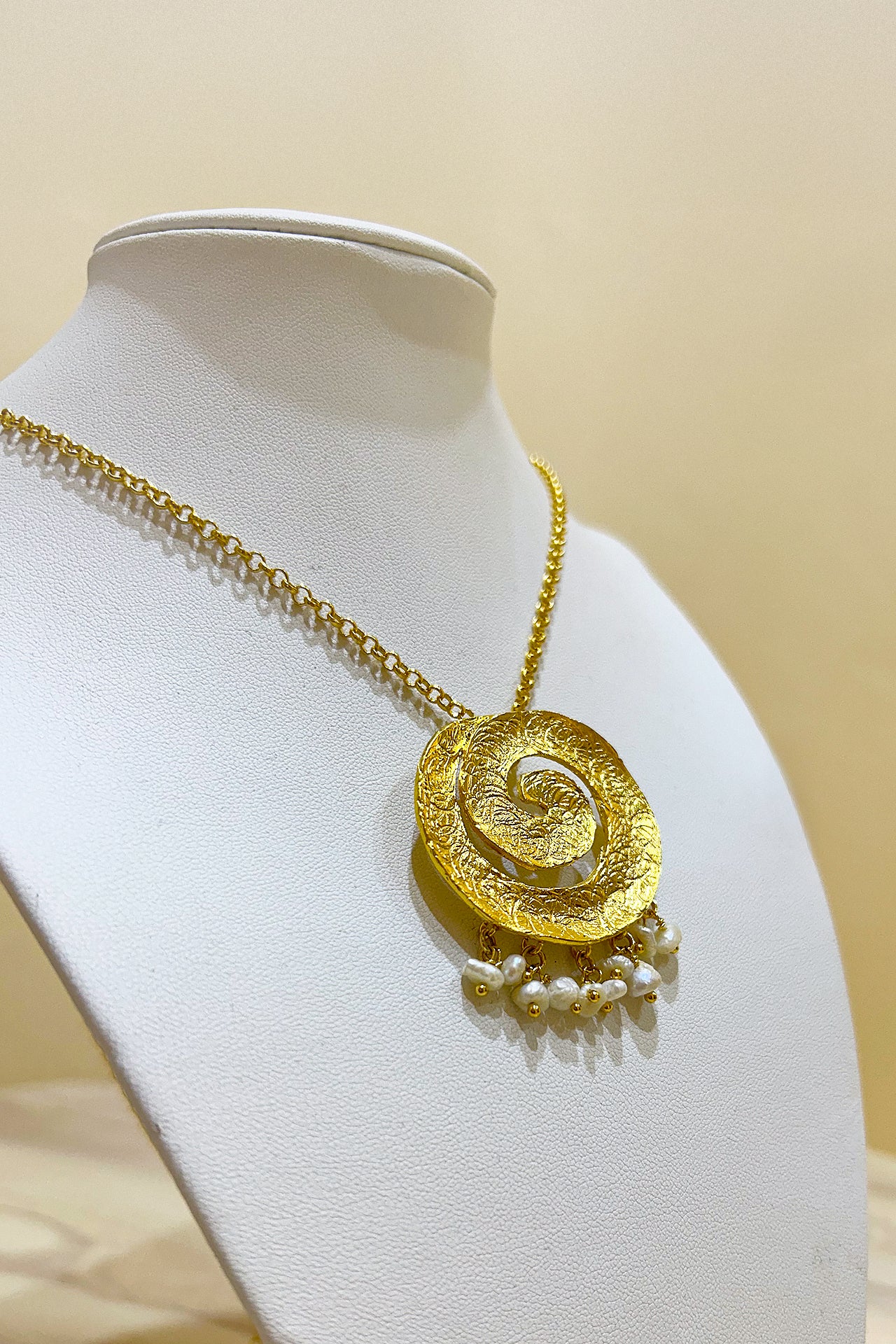 Gold Swirling Pearl Necklace by M Collection