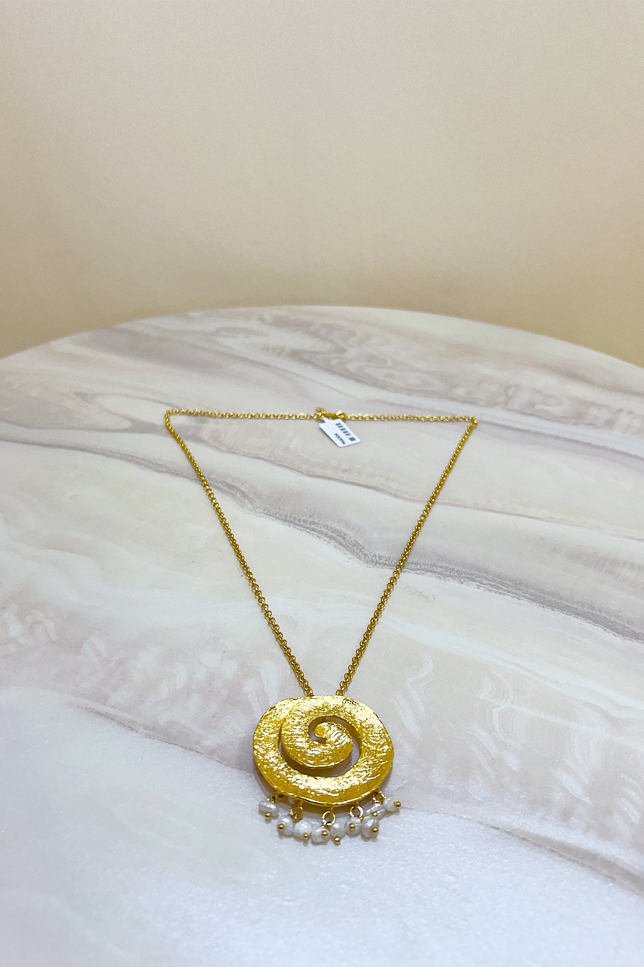 Gold Swirling Pearl Necklace by M Collection