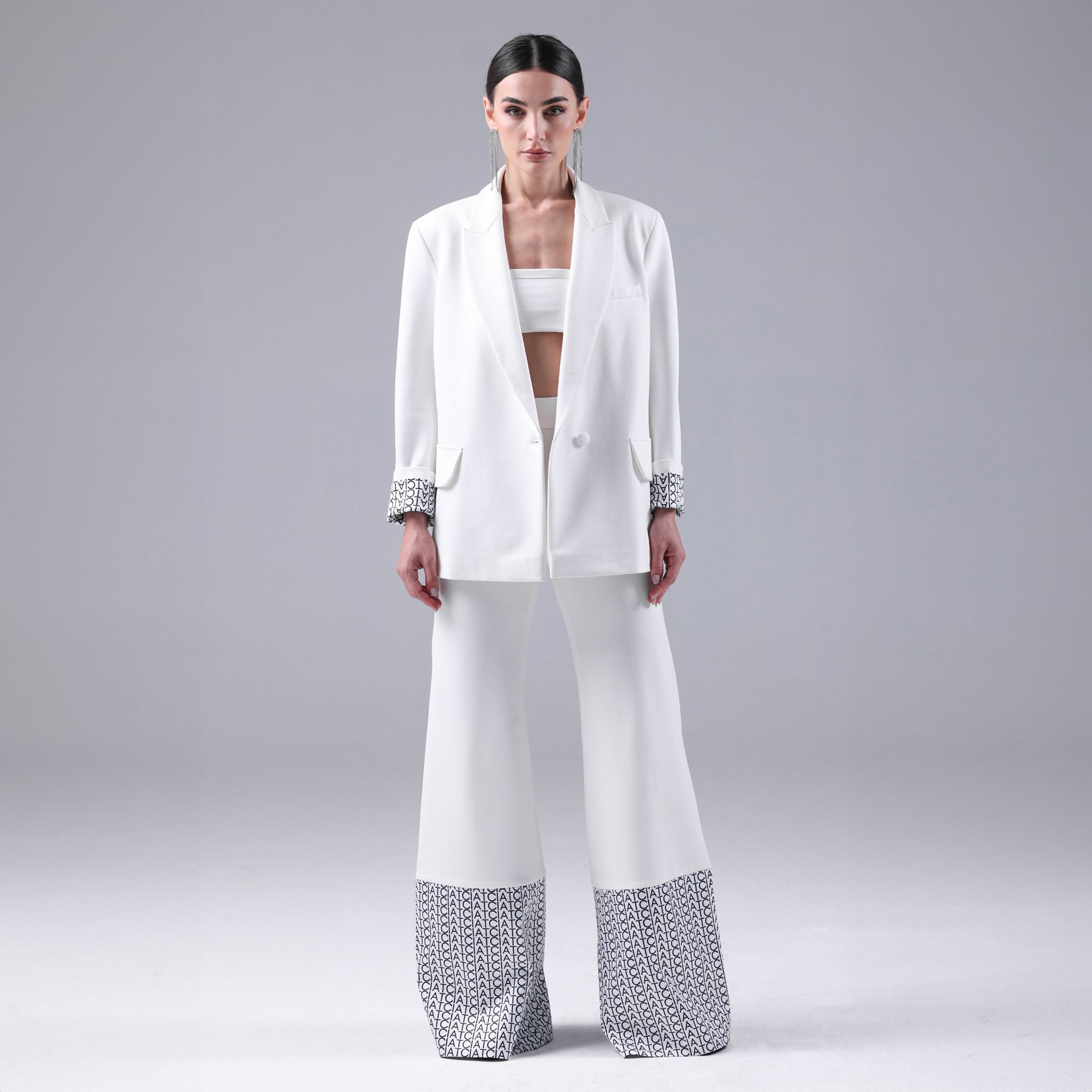 White Signature Hem Trousers By I am the Company