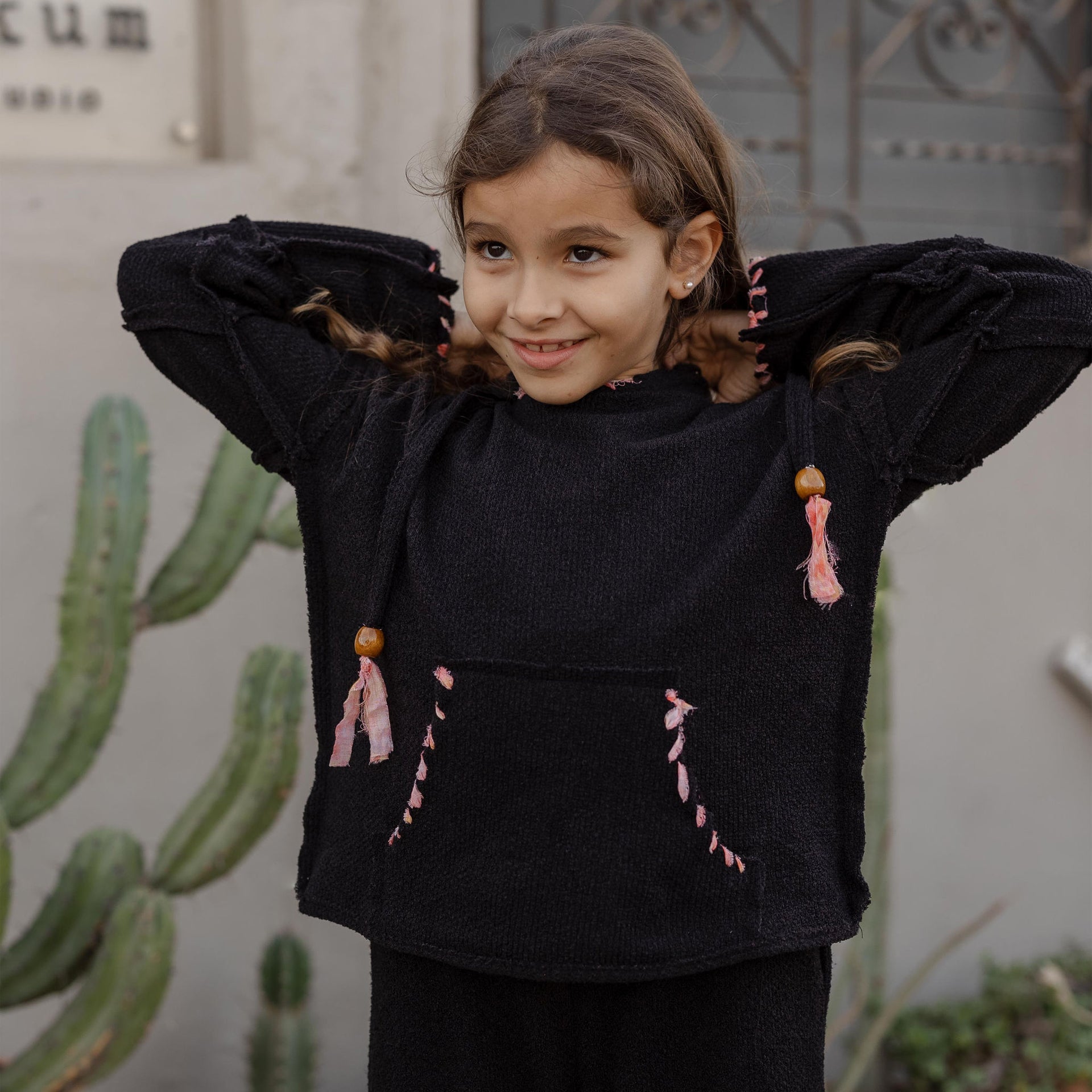 Little Stitched Up Coziness Hoodie in Black by FUFA